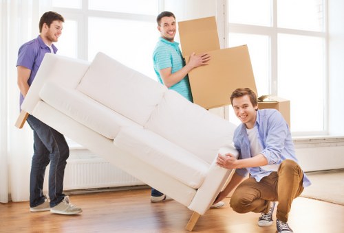 Packed moving boxes and furniture ready for transport
