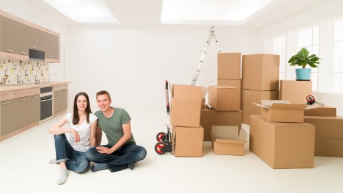 Boxes and furniture being delivered into a new home