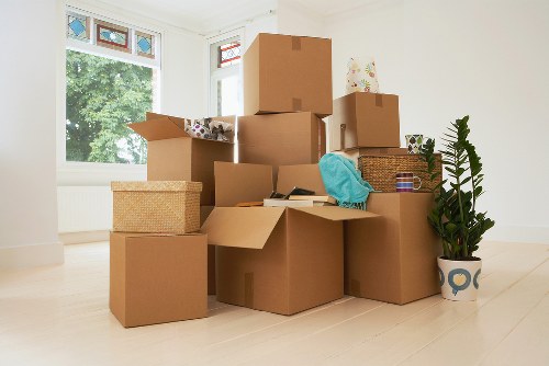 Loading household items into a van for transport in Bromley